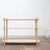 A 1970s display console in cream-beige lacquered wood, featuring three open shelves. Its decorative structure rests on...