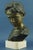 Item description: Majestic, large bronze bust with marble base depicting a young boy pouting, signed "Parente" on the...