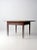 An antique wooden table with a seldom found two-plank top. Its tapered legs offer. a simple, well-proportioned form. The...