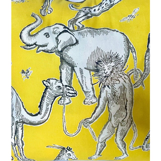 Vintage African animal print pillow. Depicts various African types of animals on a yellow background. Down filled with...