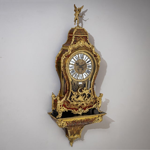 This magnificent Louis XV-style pendulum clock from the mid-19th century features elaborate Boulle marquetry and fire-...