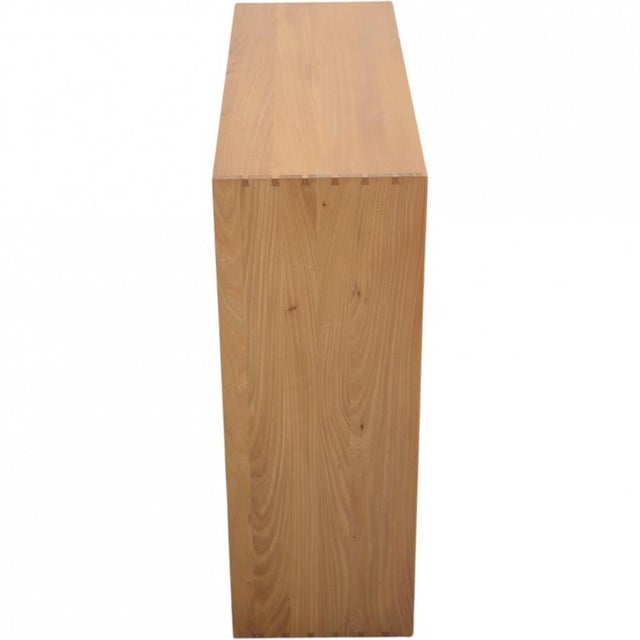 Mogens Koch bookcase made of elm, and from the 1970s. The bookcase appears in good condition with a few marks and...