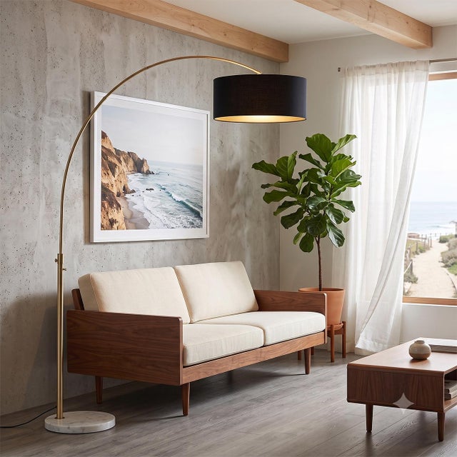 The lamp that turns any corner of your home into your favorite place to unwind. The Float Arc Lamp is a Peter Morelli-...