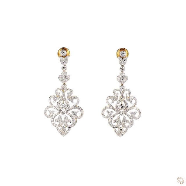 This pair of drop earrings, a 1970s design, centers on a 4.29-carat diamond in a round brilliant cut for lively, classic...