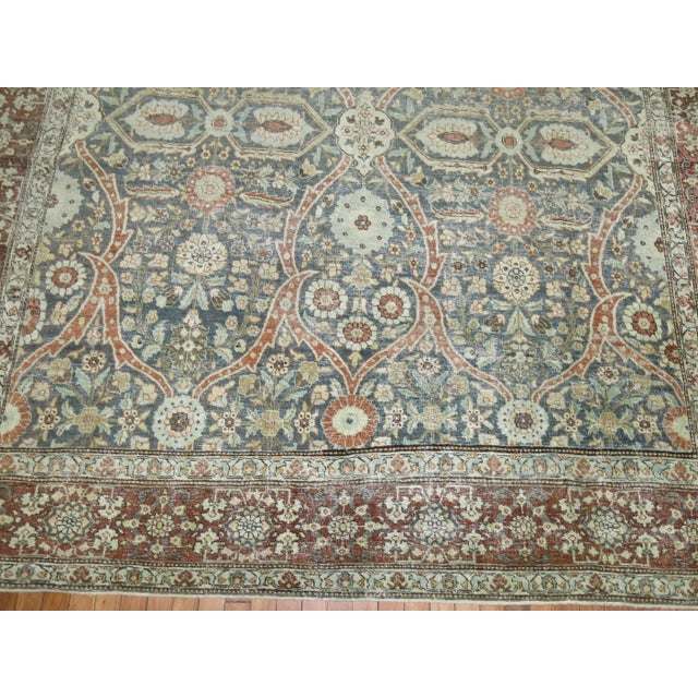 An early 20th century highly decorative Persian Tabriz rug Measures: 8'1'' x 11'4''