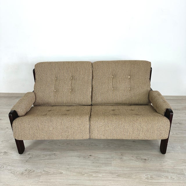 Dimensions: H 27” x W 59” x D 35.5” x SH 17.5” Vintage Danish two-seater sofa with dark wood frame and striped fabric...