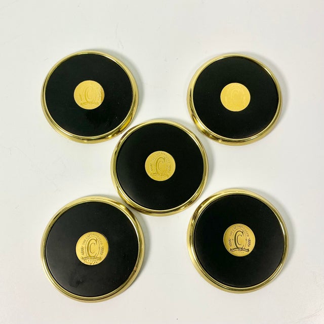 This set of traditional Hollywood Regency brass and leather coasters were a fundraising gift for a college campus...