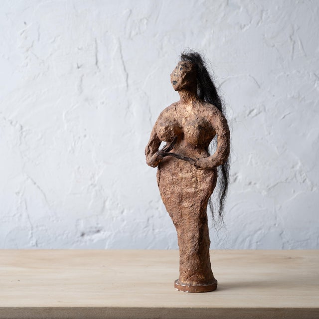 Carolyn Mae Lassiter (American, b.1945) A painted paper mache and hair figural sculpture, 1993. 6 ½ inches wide by 3 ½...