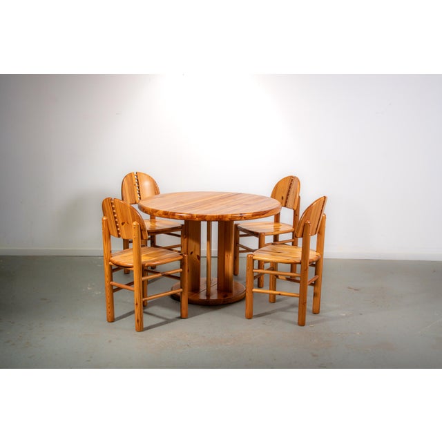 Pine dinning room set by Ranier Daumiller made in Denmark in the 1980s. with 4 chairs and a round table with decorative...