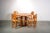 Pine dinning room set by Ranier Daumiller made in Denmark in the 1980s. with 4 chairs and a round table with decorative...