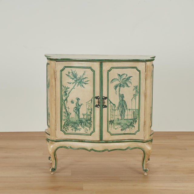 Alluring vintage Italian two door cabinet crafted in hardwood in serpentine form,hand decorated in green chinoiserie over...