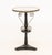 French White Marble Top and Ebonized Wood Gueridon, with brass scroll work motif on trefoil base. 26" H x 16.75" Diameter....