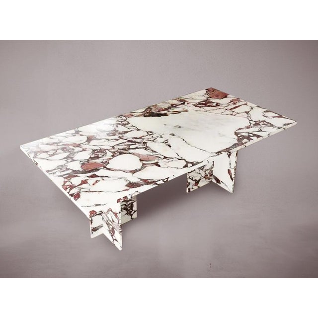 Elevate your dining experience with our exquisite rectangular T-legged dining table, crafted from luxurious Calacatta...