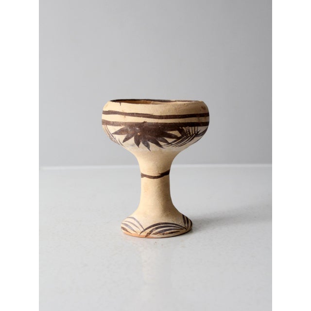 his vintage Mexican folk art goblet features a flared, footed base and wide bowl-shaped body with a slightly flared rim,...