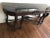 This is a beautiful black onyx marble credenza table, circa 1920. The piece features carved dark mahogany, with one large...