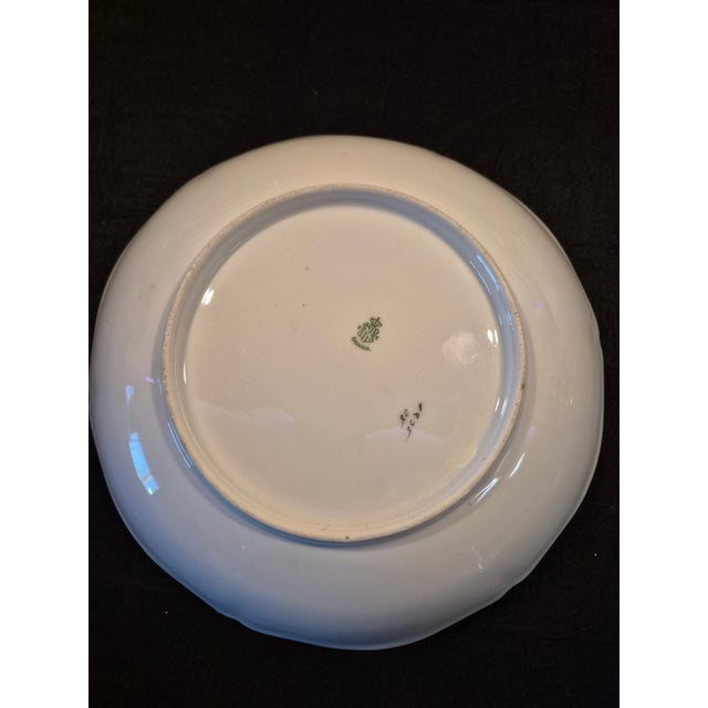 This is an antique Bavarian porcelain display plate or shallow bowl featuring a scalloped, molded rim and an asymmetrical,...