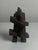 Two abstract cast concrete sculptures in the brutalist idiom. Hand-carved or hand-finished geometric forms—one with...