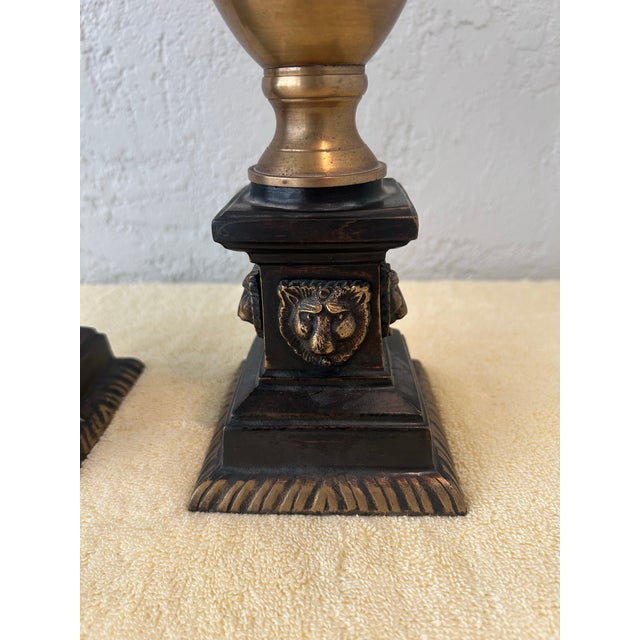Vintage 1970’s neoclassical brass urn-style candle holders featuring palm tree shaped tops