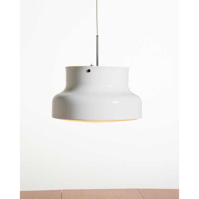 Pendant lamp in white lacquered metal with a plastic grille underneath and a double light source. Anders Pehrson for...