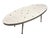 An atomic style surfboard shaped coffee table in the manner of Gordon Martz. The table top is decorated with tessellated...