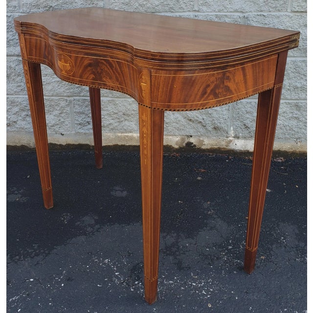 1920s Federal Style Satinwood Inlaid Flame Mahogany Serpentine Card Table in good antique condition. Very sturday....