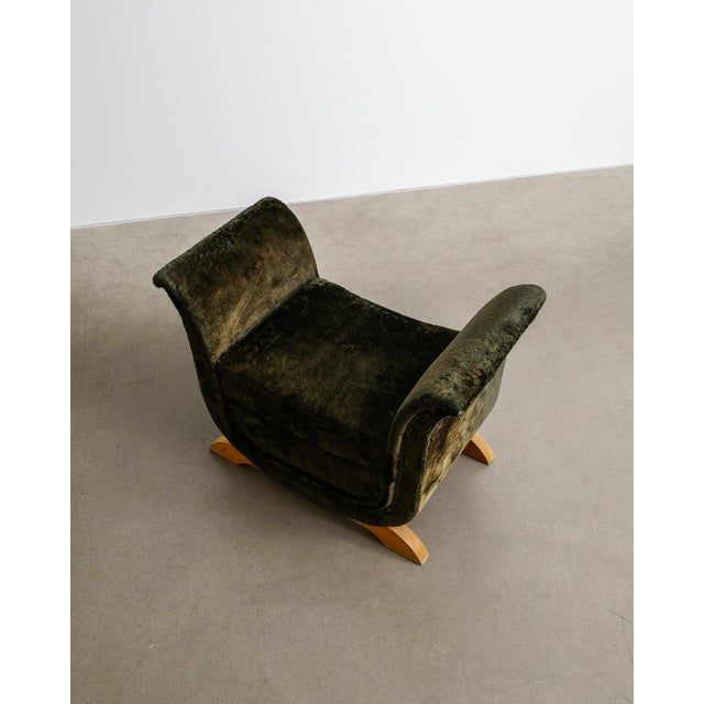 A rare and early swedish mid century modern low tabouret / sewing stool in green original velvet with sculptural wooden...