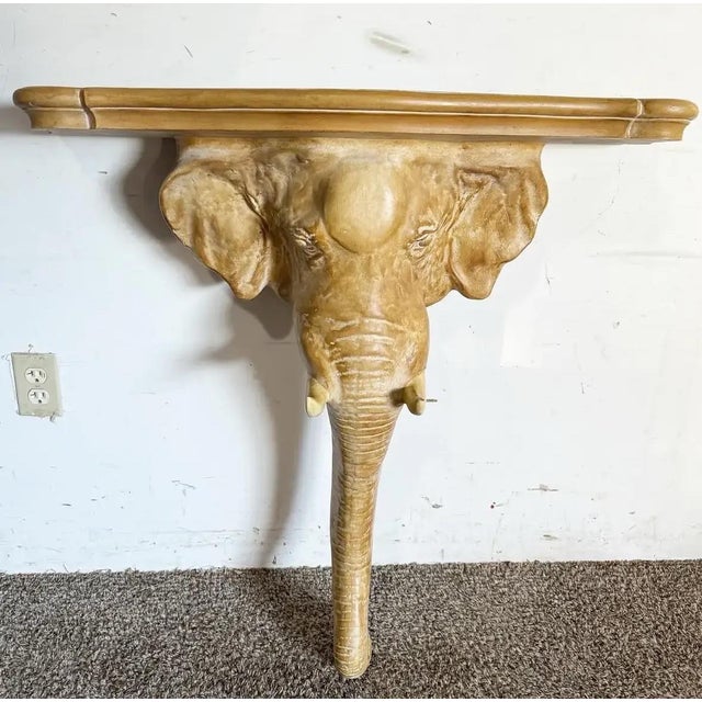 Immerse yourself in the classic Palm Beach and coastal elegance with this 1970s Elephant Sconce Console Table by Chapman....