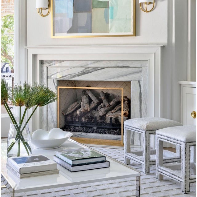 The August fireplace screen redefines modern elegance with its simplicity. Hand-forged of iron and featuring a step-up...