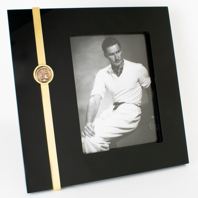This stunning modernist picture frame was designed by renowned Italian designer Tommaso Barbi. The piece was meticulously...