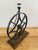 Cast iron, wheel shaped table lamp with a small center flower by Restoration Hardware. A beautiful, substantial piece in...