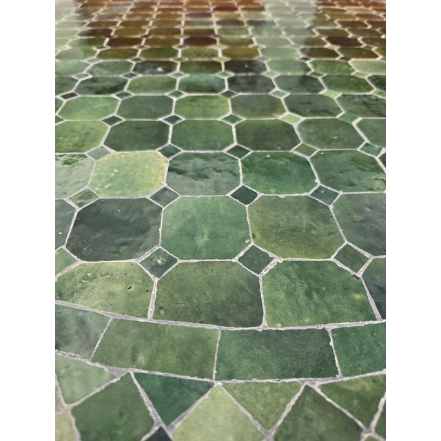 Beautiful handcrafted Moroccan mosaic table featuring an elegant green color palette. Measuring 40 inches in diameter,...