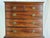 A George III style mahogany bow front chest of drawers on a later stand. Drawer fronts with replacement brass pulls....