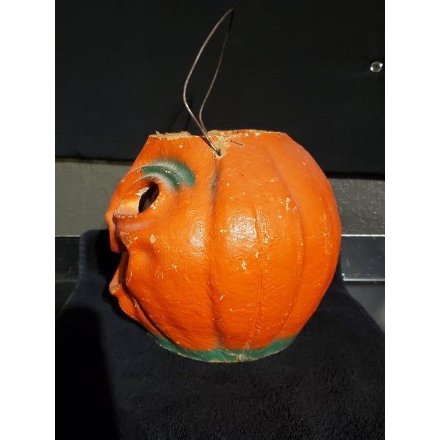 Papier Mache' Halloween Jack-O’-Lantern Everything about it screams pre-war: · Thick pulp walls · Clear vertical mold seam...