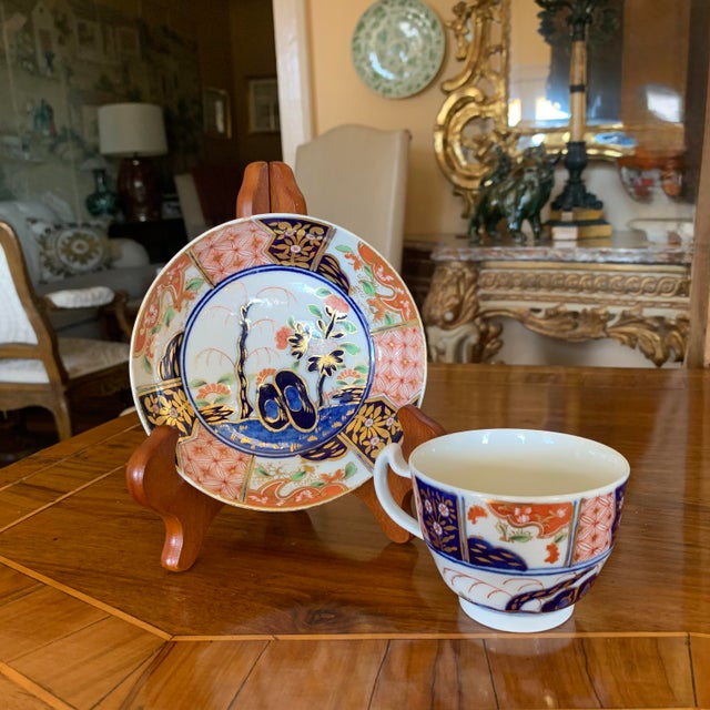 A Fine Early 19th Century English Gilt Imari Tea Cup and Saucer, in Pattern #310, Featuring the Chinese Inspired Willow...