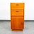 A Danish Modern teak compact cabinet featuring 1 cabinet and 2 teak drawers. Made in Denmark, circa 1970s.