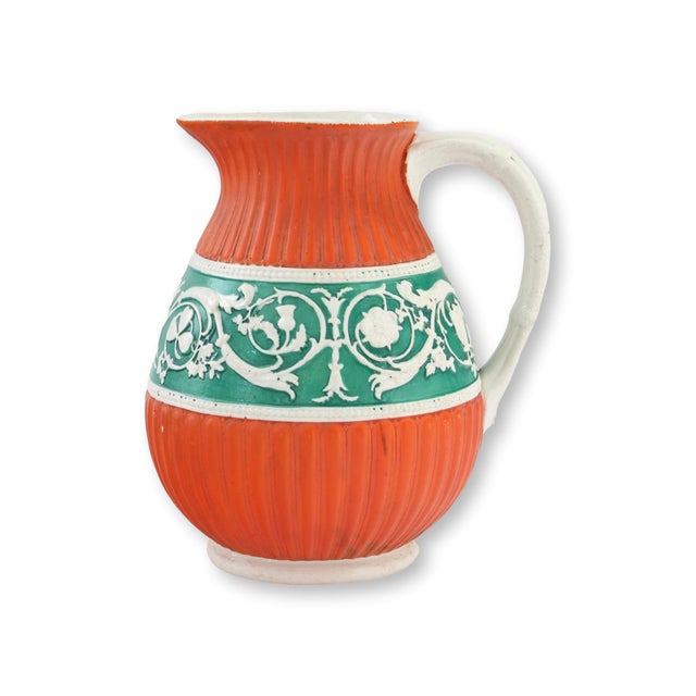 Mid 19th century English salt glaze water pitcher marked for Ashworth Brothers Potteries, featuring highly unusual orange...