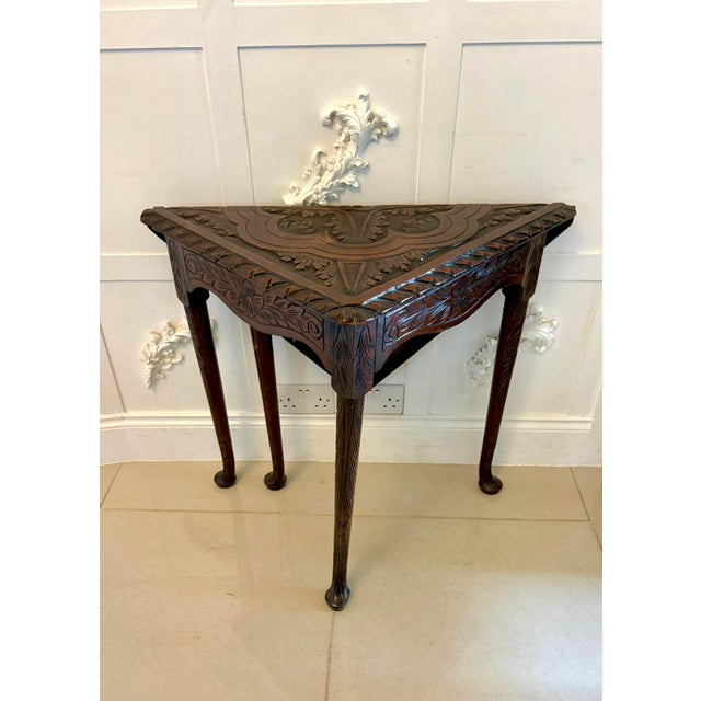 A charming antique George III carved mahogany folding corner table dating to around 1800, displaying excellent...