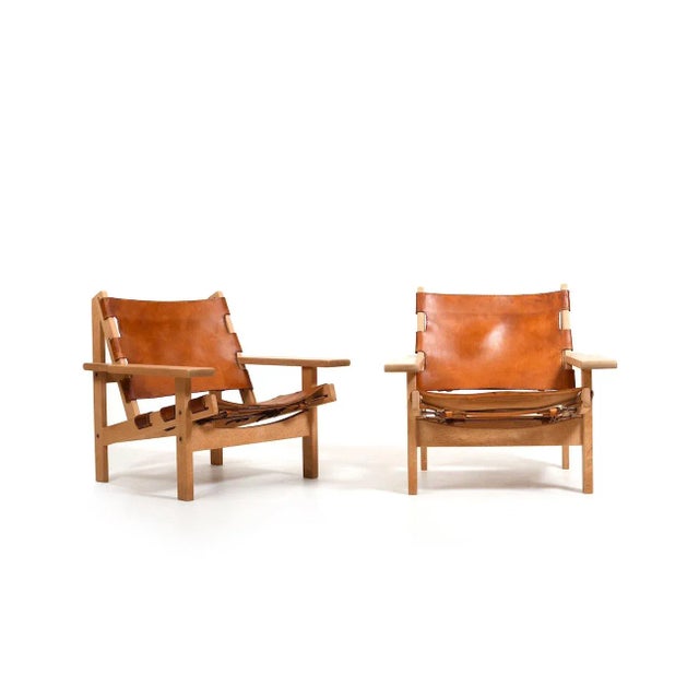 Pair of fine Danish hunting chairs in oak and cognac saddle leather by Kurt Østervig for KP Møbler Denmark 1960s. Model...