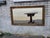 This mid-twentieth-century heavily carved wall fireplace mirror is an antique piece with a Victorian-era design. The...