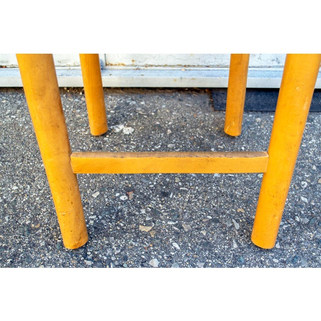 Four stools with wooden structure, sitting in straw. In Charlotte Perriand's style Italian production 70's This piece is...