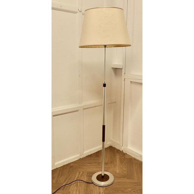 Mid Century Modern Chrome and Wood Telescopic Floor Lamp A great designer piece in chrome and dark wood, the lamp has an...