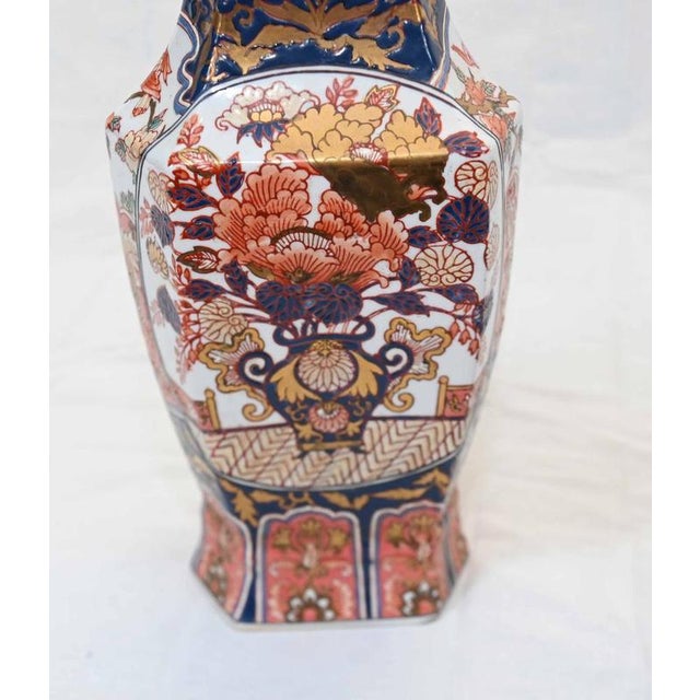 Fine pair of Japanese Imari porcelain vases dating to the late 19th century Of elegant faceted baluster form with flared...