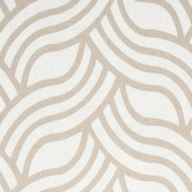 Curvaceous, undulating lines of appliqu√© create a striking contrast with a chunky, solid twill ground for a laid-back...
