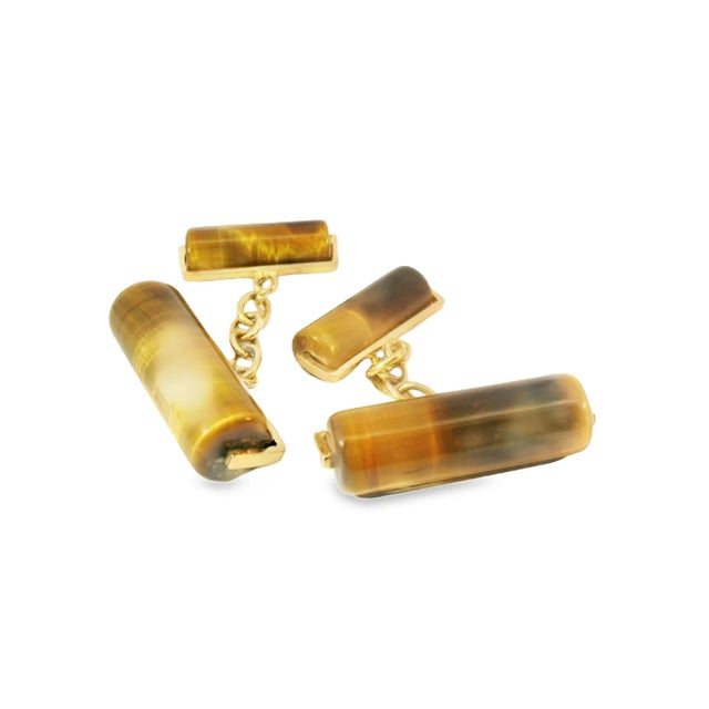 These striking 14K Yellow Gold Tiger Eye Cufflinks are a bold and sophisticated accessory, perfect for adding a touch of...