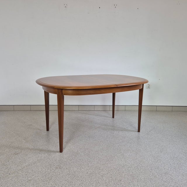 Extendable walnut-veneered table by Kondor, Germany, 1960s Dimensions: height – 75 cm width – 140 cm × 105 cm width when...