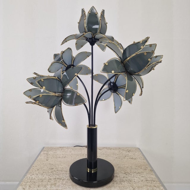 An exceptional and highly atmospheric vintage Hollywood Regency lotus flower table lamp from the 1980s. This statement...