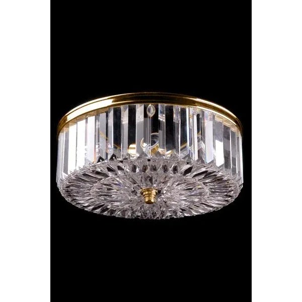 Cut crystal flush mount, 4 inch baguette crystals on outside, patterned crystal on bottom, Cast rim surround on top of...
