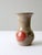 This is a vintage studio pottery vase. Signed by the artist, the large handmade vase has a hand-painted and etched apple...