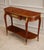 Elegant French Louis XVI-style console table crafted in richly figured wood with exquisite decorative marquetry and...