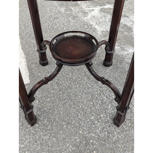 Elevate your home with the timeless elegance of this Early 20th Century Mahogany Round Parlour Table. This exquisite two-...